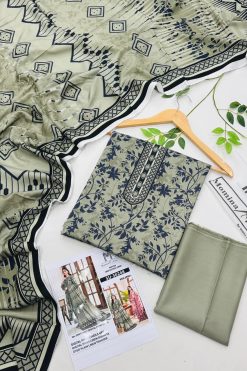 Momina Linen Unstitched 3PC suit – premium winter collection with shirt, dupatta, and trouser in elegant designs.